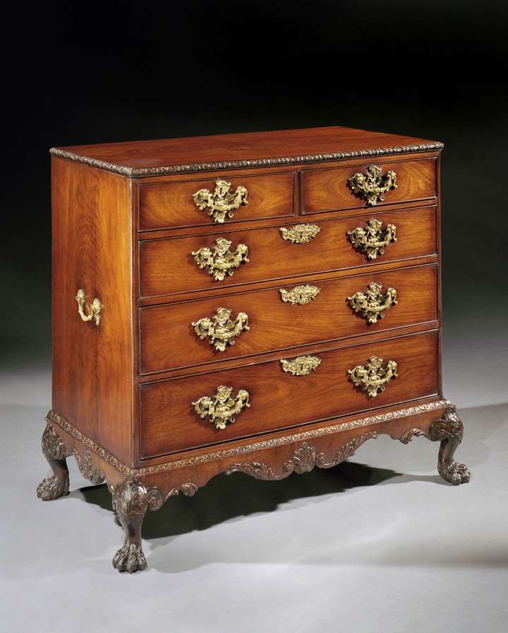 A George II rosewood chest of drawers on stand attributed to Otho Channon